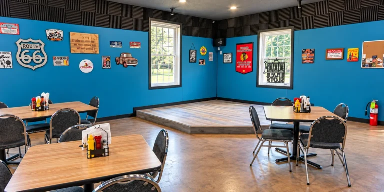 Tables and stage inside the Miles Bar and Grill dining room